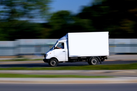 Blur speedy  white van with white blank for your textの写真素材