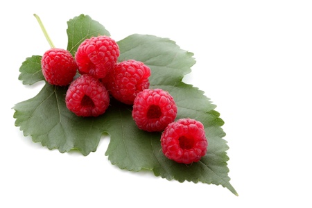 Berries ripe, red raspberry with green leaf isolated on white の写真素材