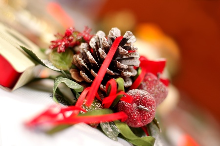 Christmas decoration with  candle, cone and spruce tree on holiday tableの写真素材