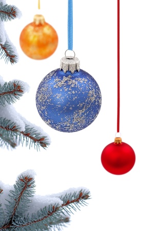 Christmas evergreen spruce tree and glass ball on snow backgroundの写真素材