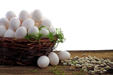Easter eggs and  natural wooden country table, background and textureの写真素材