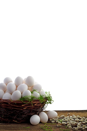 Easter eggs and  natural wooden country table, background and textureの写真素材