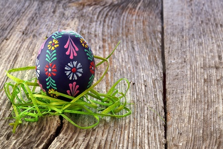 Easter eggs and  natural wooden country table, background and textureの写真素材