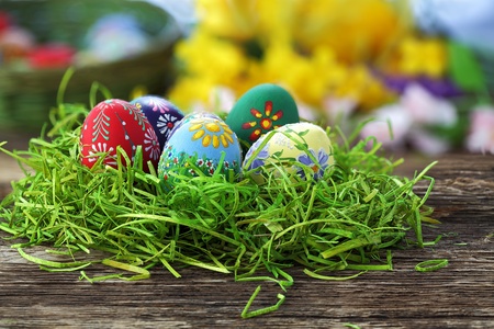 Easter eggs and  natural wooden country table, background and textureの写真素材