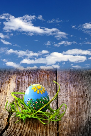 Easter eggs and  natural wooden country table, background and textureの写真素材