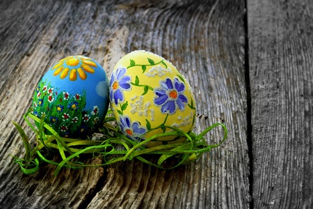 Easter eggs and  natural wooden country table, background and textureの写真素材
