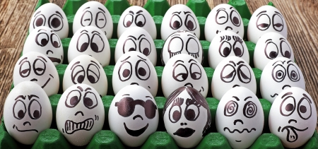 White eggs and  many funny facesの写真素材