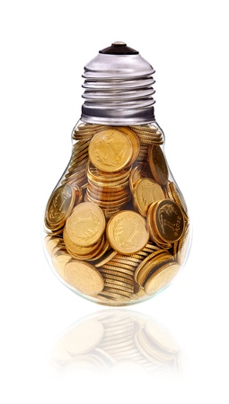 Traditional light glass bulb with many golden coinsの写真素材