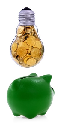 Traditional  lightbulb with  golden coins and green piggy bank, creative business symbolsの写真素材