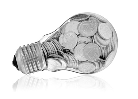 Traditional glass bulb with many silver coinsの写真素材