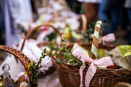 Ordination ceremony of Easter baskets in Polish church in Wroclaw. Collection of different  baskets inside the church, background and blurの写真素材