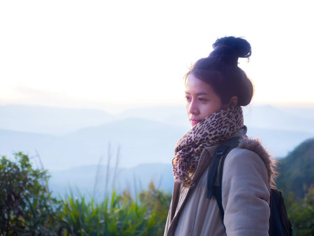 Asian young woman enjoy and happiness beautiful the morning sunriseの写真素材