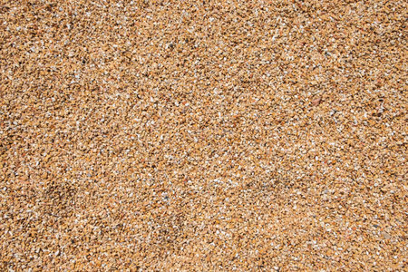 background made of little pebbles stones in the beach