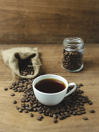 black coffee and coffee bag with wood backgroundの写真素材