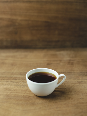 black coffee with wood backgroundの写真素材