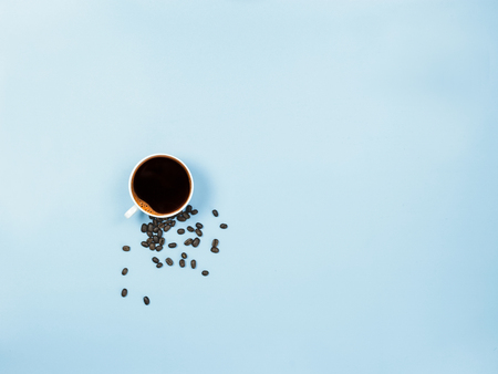 top view black coffee and coffee beans on blue background 6の写真素材