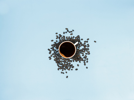 top view black coffee and coffee beans on blue background 6の写真素材