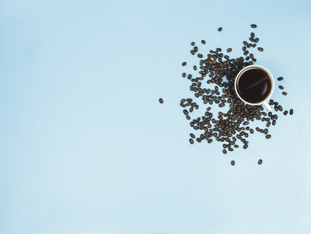 top view black coffee and coffee beans on blue background 6の写真素材