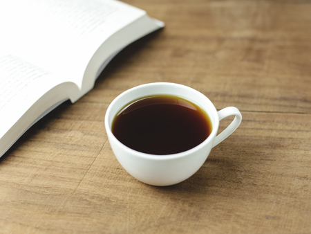 black coffee and books on wood backgroundの写真素材