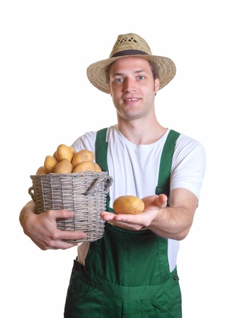 Friendly gardener showing his potatoの写真素材
