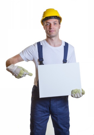 Construction worker with a white signの写真素材