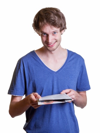 Young guy reading the newsの写真素材