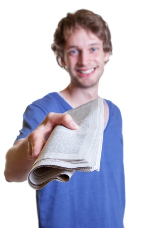 Young guy offering the newsの写真素材
