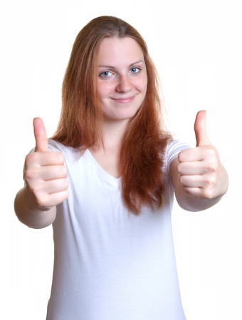 Smiling girl showing both thumbsの写真素材