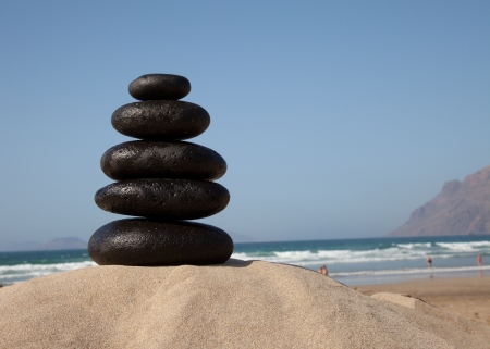 Stone stacks with sea wavesの写真素材