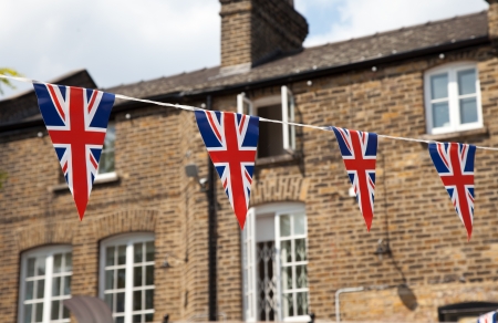 Flag of Great Britain with house in backgroundのeditorial素材