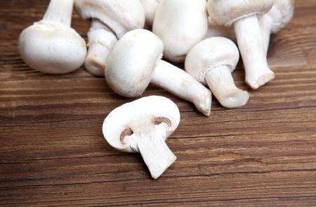White mushrooms on wood の写真素材