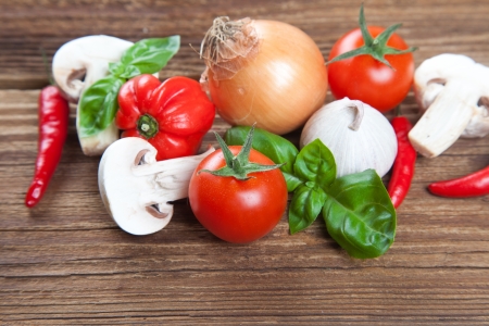 Group of fresh vegetables and herbs on old wood の写真素材