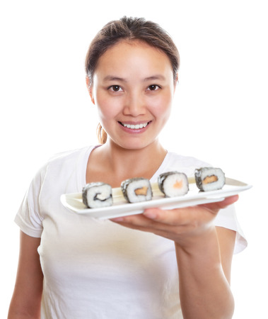 Japanese waitress presenting sushiの写真素材