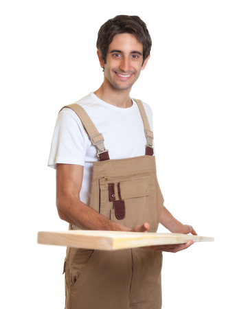 Carpenter working with wooden beamの写真素材