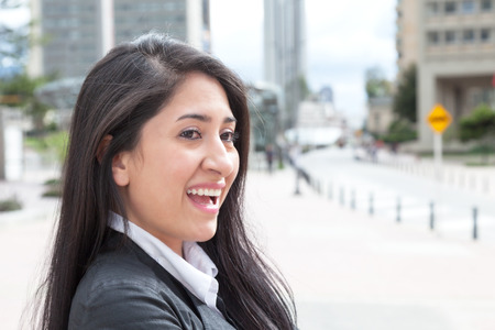 Happy latin woman in the cityの写真素材