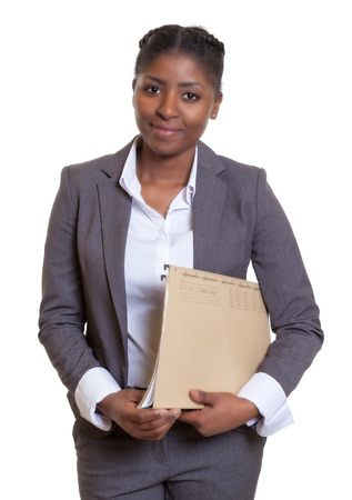 Smiling african business woman with fileの写真素材