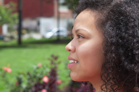 Thinking colombian woman outside in a parkの写真素材