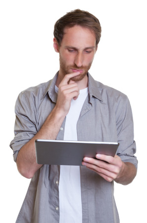 German guy reading on tablet computerの写真素材