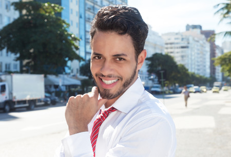 Handsome latin businessman in the cityの写真素材