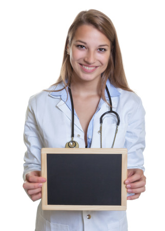 Young caucasian female doctor with chalk boardの写真素材