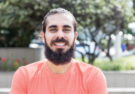 Laughing guy with beard in the cityの写真素材