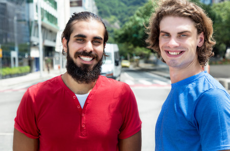 Modern caucasian guy with arabian friendの写真素材