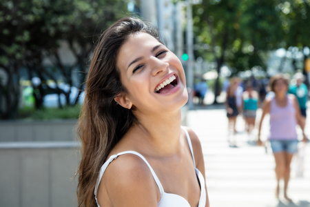 Happy caucasian girl in the cityの写真素材