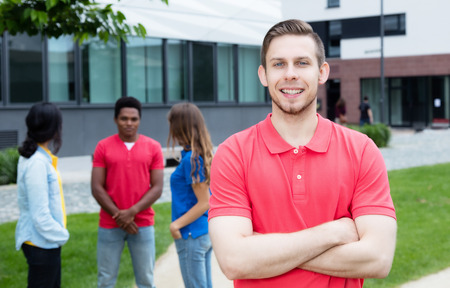 Caucasian male young adult with friends outdoor