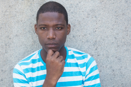 Poor and sad african american man outdoorsの写真素材