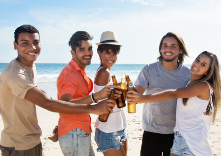 Group of young people celebrating spring break outdoor at beachの写真素材