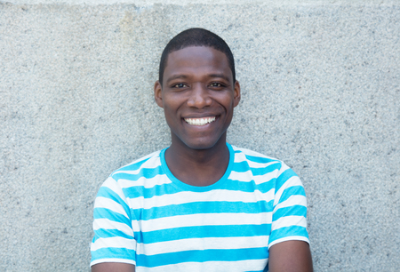 Happy laughing african american man outdoors in the summerのeditorial素材