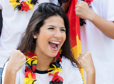 Happy german soccer fan at stadiumの写真素材