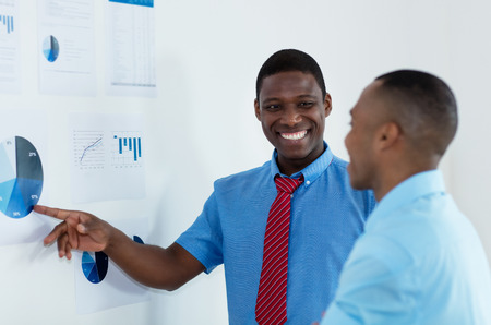 African american businessman explaining business strategy at office of start up companyの写真素材