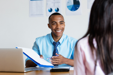 African american businessman presenting contact for new jobの写真素材